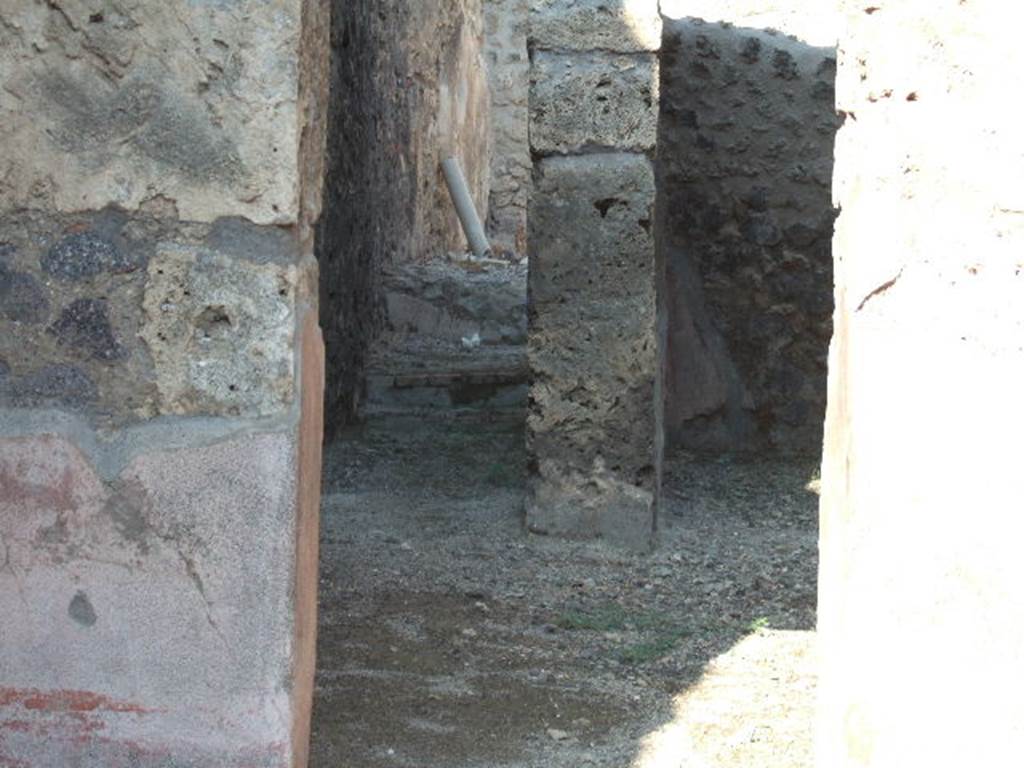 IX.2.12 Pompeii. September 2005. Looking east through rear door towards corridor/steps leading to rear rooms.