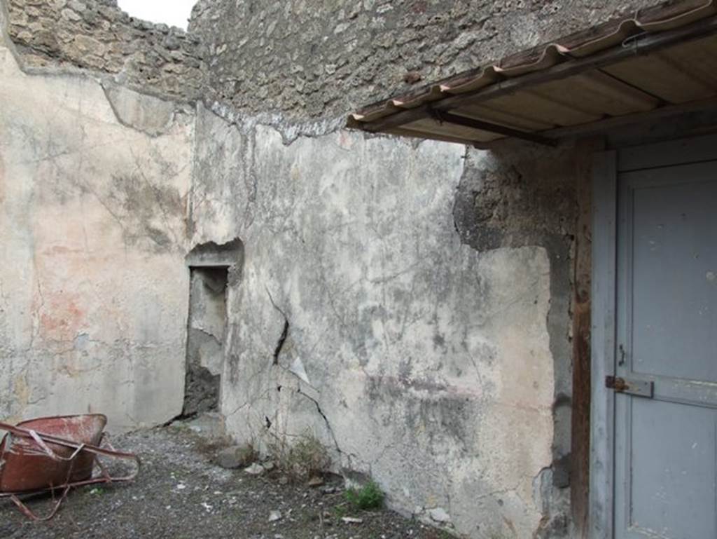 IX.2.16 Pompeii. December 2007. East wall of atrium. On the east side of the atrium was a triclinium. According to Sogliano, paintings found in this room were –
Hercules and Nessus (p.83, no.501)
Bellerophon (p.92, no.522)
Amazons (painting damaged to upper left corner) (p.100, no.547)
See Sogliano, A., 1879. Le pitture murali campane scoverte negli anni 1867-79. Napoli: Giannini. 
According to BdI, paintings found in this room were –
North wall – Bellerophon and the amazons 
East wall – Bellerophon and Stheneboea
West wall – Hercules and Nessus.
See BdI, 1871, (p.200-204)
According to Jashemski, Schefold reported a fine garden painting on the north wall under the painting of Bellerophon and the amazons, but the plaster had fallen, and no drawing had been preserved.
See Schefold, K., 1957. Die Wände Pompejis. Berlin: De Gruyter. (p.243)
See Jashemski, W. F., 1979. The Gardens of Pompeii. New York: Caratzas. (p.401)