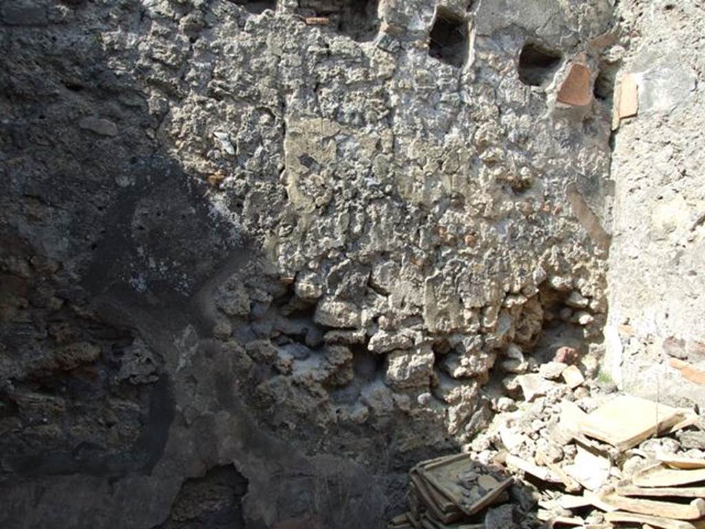 IX.2.17 Pompeii. March 2009. Room 10, north wall. On this wall, the big square holes were for the sturdy support beams of the ceiling.