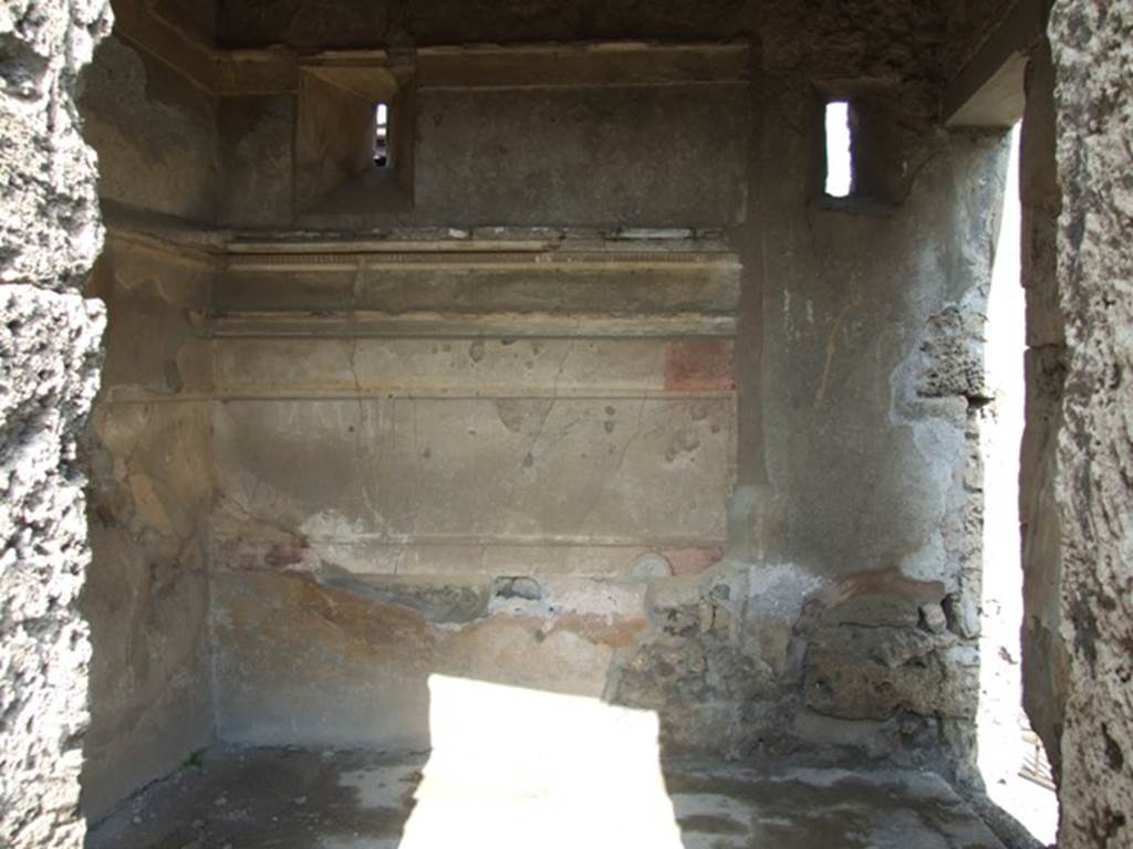 IX.2.17 Pompeii. March 2009. Room 2, cubiculum. Looking east. On the right is the doorway from the entrance fauces/corridor, which would have lead to the stairs to the upper floor.