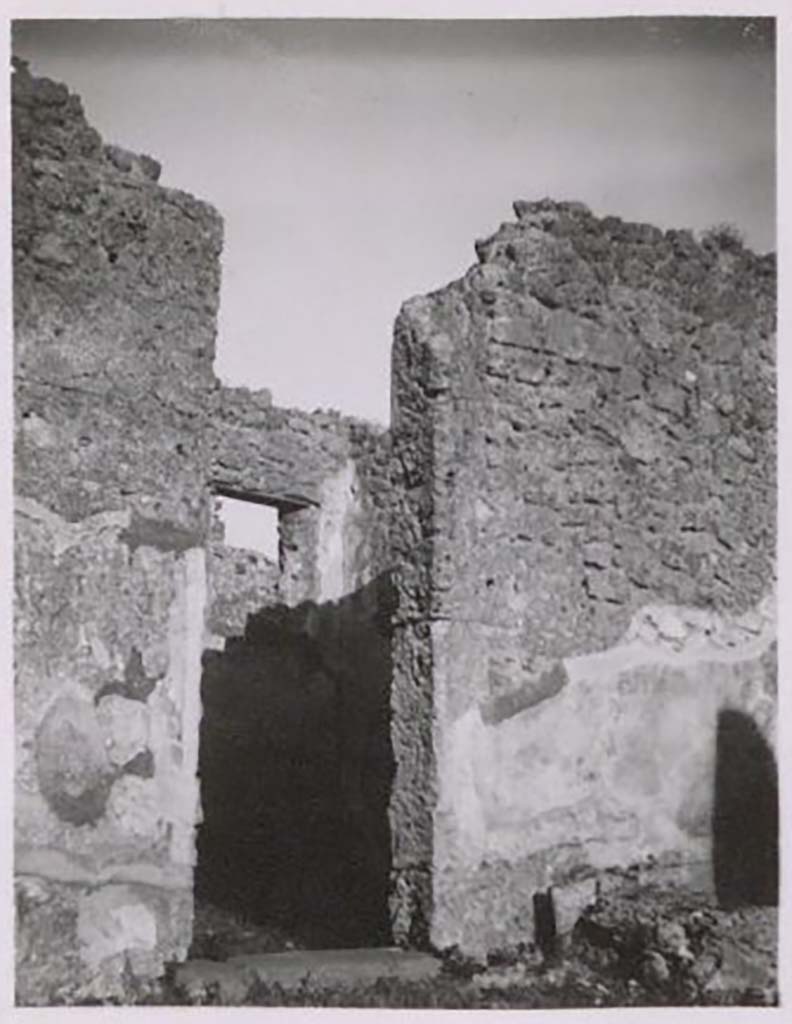 IX.2.17 Pompeii. Pre-1943. Doorway to room 3, triclinium. Photo by Tatiana Warscher.
According to Warscher – this room had a window overlooking Vicolo di Tesmo.
The paintings from the walls had vanished without leaving any trace. 
See Warscher, T. Codex Topographicus Pompeianus, IX.2. (1943), Swedish Institute, Rome. (no.88.), p. 170.
The remains of the arca/money chest base can be seen bottom right.