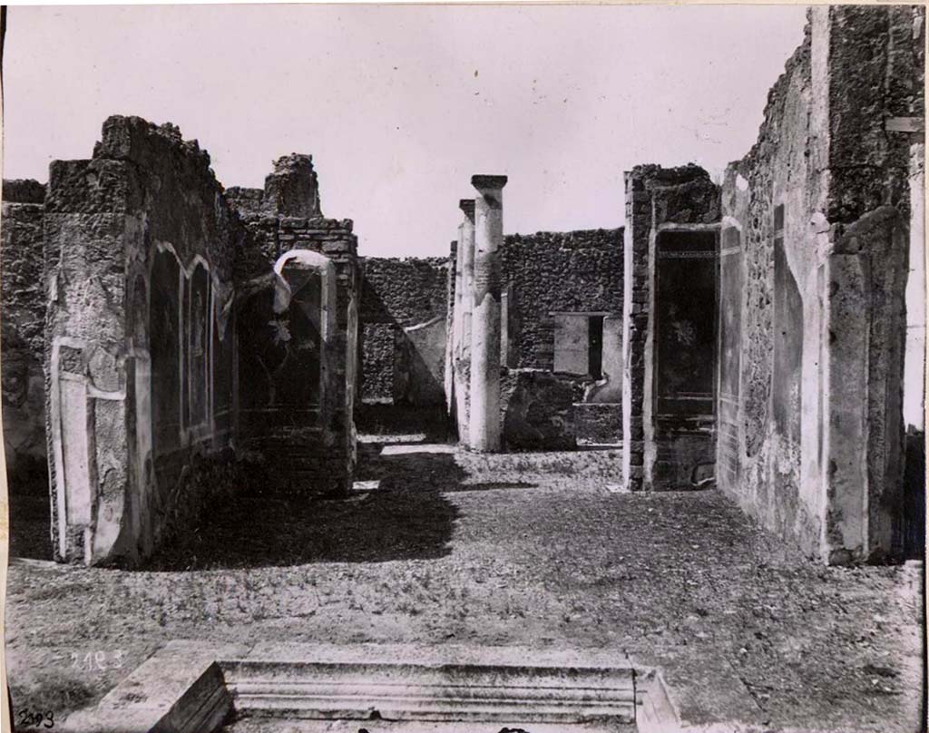 IX.2.18 Pompeii. Old undated photograph of room 5, tablinum, looking into garden area.
This old photograph shows the three painted walls: in the middle of the south wall was Ares enthroned, flanked on the east side panel by a vignette of a flying figure.
This probably was repeated by the panel on the west side, but which was incomplete at that place.
In the west wall, the panels on either side of the doorway to the garden area showed a vignette of a flying cupid.
On the north wall, there were panels with vignettes of flying figures. In the centre of the north wall would have been a large gap.
See Warscher, T. Codex Topographicus Pompeianus, IX.2. (1943), Swedish Institute, Rome. (no.97.), p. 178.