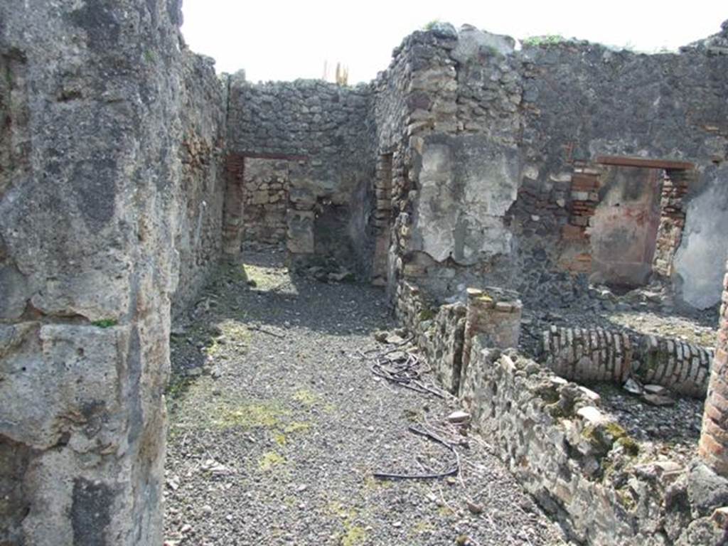 IX.2.18 Pompeii. March 2009. Room 11, garden area.  Looking west along the south portico, towards kitchen area. On the right are the doorway and window of the cubiculum or triclinium, room 10.