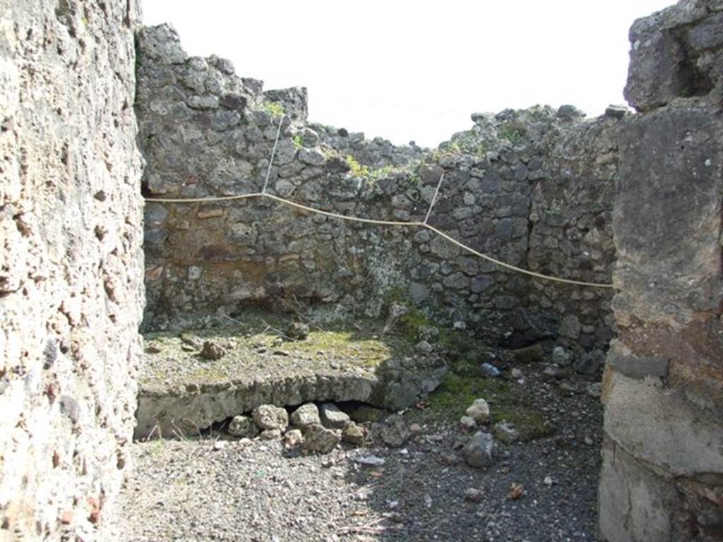IX.2.18 Pompeii. March 2009. Room 8, kitchen. Masonry hearth, and remains of latrine against the south wall.
