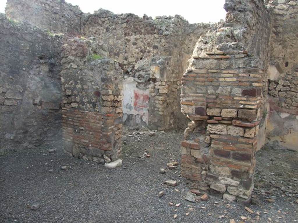 IX.2.21 Pompeii. March 2009. Doorways to rooms 13 and 14, from north portico.  According to Boyce, in these two cubicula many objects were found including jewellery and four bronze statuettes:
One was “Abbondanza” holding a cornucopia in the left hand and a patera in the right – probably the Genius -
and Minerva, helmeted and holding a spear in the right hand, and a shield on the left arm.
Also found were the two Lares, each holding rhyton and patera.
See Boyce G. K., 1937. Corpus of the Lararia of Pompeii. Rome: MAAR 14. (p.81)
Boyce’s reference was given as Giorn. Scavi, N.S., ii, 1872, 281.