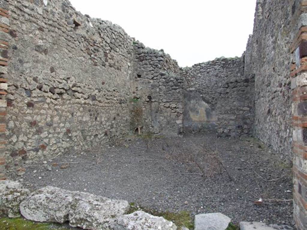 IX.2.23 Pompeii. March 2009. Looking south to rear room. The stairs to the upper floor would have been on the left side. The latrine would have been beneath the stairs, in the south-east corner of the shop-room.
