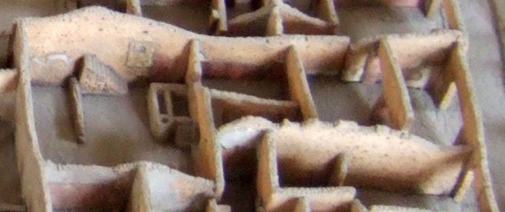Part of the cork model of Pompeii in the Naples Archaeological Museum showing IX.2.24. The yard on the left shows the staircase and the Lararium referred to by Fröhlich. See Fröhlich, T., 1991, Lararien und Fassadenbilder in den Vesuvstädten.  Mainz: von Zabern.  (L99: p.293, T. 42,3).
