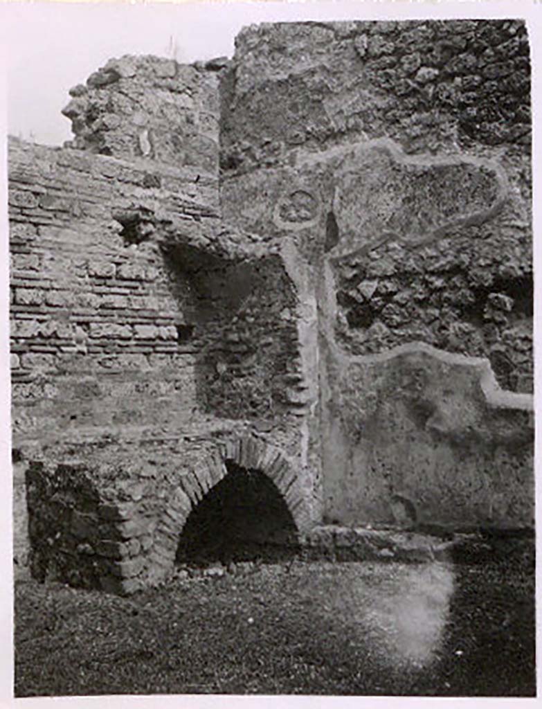 IX.2.25 Pompeii. Pre-1943. Hearth in north-east corner of caupona. Photo by Tatiana Warscher. 
See Warscher, T. Codex Topographicus Pompeianus, IX.2. (1943), Swedish Institute, Rome. (no.126.). p. 220.