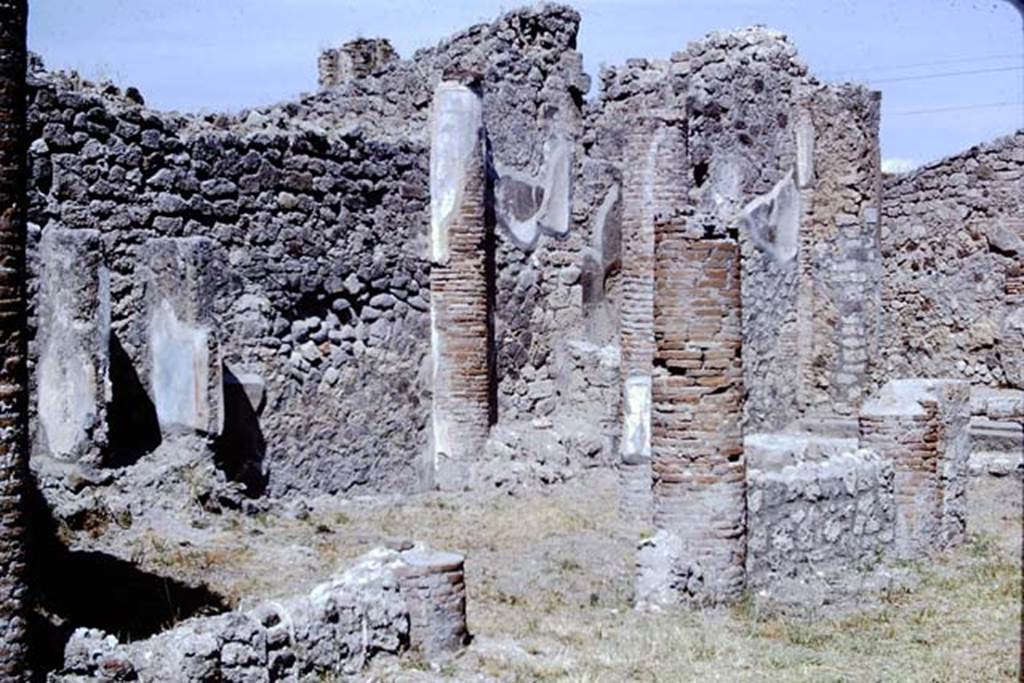 IX.2.27 Pompeii. 1966. Looking towards west wall of the peristyle, with remains of shrine, on left.  Photo by Stanley A. Jashemski.
Source: The Wilhelmina and Stanley A. Jashemski archive in the University of Maryland Library, Special Collections (See collection page) and made available under the Creative Commons Attribution-Non Commercial License v.4. See Licence and use details.
J66f0469