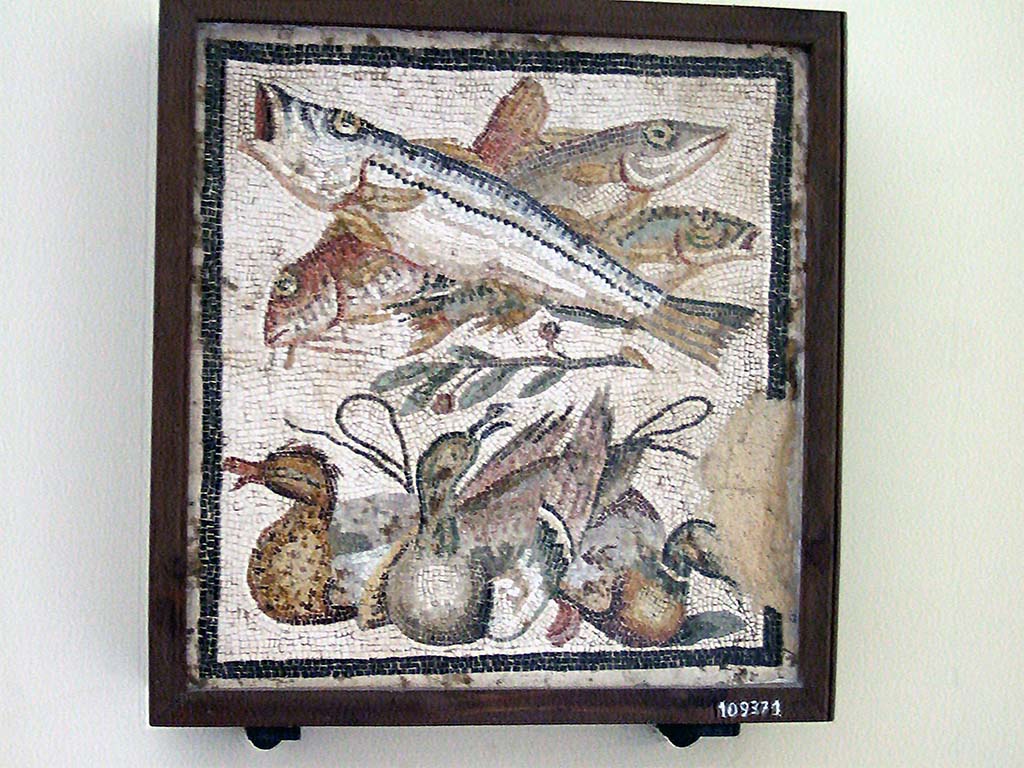IX.2.27 Pompeii. Mosaic of ducks and fish found in a cubiculum on the east side of the atrium.
This was the emblema in the centre of a black and white mosaic. 
Now in Naples Archaeological Museum, inventory number 109371.