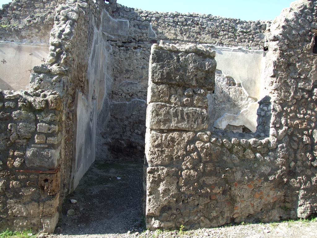 IX.3.2 Pompeii. March 2009. Doorway and window of triclinium on north side of garden area.