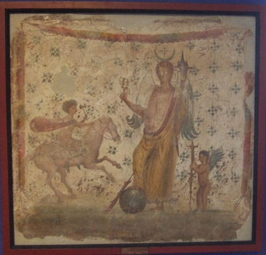 IX.3.7 Pompeii.  Picture of Isis Fortuna with horn of plenty and sistrum and with a foot on a globe. 
To the right is Hesperus and left is Helios or Harpocrates - Helios.
Now in Naples Archaeological Museum, where it is shown as from IX.3.15. 
Fröhlich says this picture was found on the north wall of the shop IX.3.7.
He points out that the painting was described by Panofka in 1847, so it could not be IX.3.15 which was first excavated in 1861.
See Fröhlich, T., 1991, Lararien und Fassadenbilder in den Vesuvstädten.  Mainz: von Zabern.  (L101: p.294).
Others believe the painting of Isis-Fortuna (MN 8836) was found in 1847 in IX, iii, 15 on the north wall of a cubiculum.  
It was discovered while carrying out work on one of the walls of the Casa di Suonatrici which joined the two houses. 
Our thanks to Raffaele Prisciandaro for his help in identifying the following sources:
Casa di Philocalus; parete N del cubicolo; CIL 04, 882 (197); 
Bulletino Archeologico Italiano, 1, 1862, n. 20, 1862, pp. 159 160; 
Panofka, BdI 1847, pp. 127-128 “nell’appoggiar una delle mura della casa delle Suonatrici si è scoperta al muro della casa accanto una pittura …” 
According to PPM, there was no agreement on whether the painting depicting Isis-Fortuna, now at Naples Museum, came from this shop.
See Bragantini I., in 1990-2003. Pompei: Pitture e Mosaici.  Roma: Istituto della enciclopedia italiana, Vol. IX, p.314, p. 335.