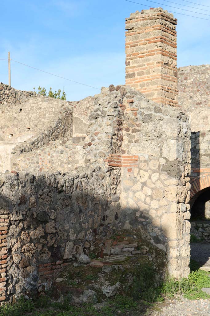 IX.3.10 Pompeii. December 2018. 
Masonry remains on north side of doorway linking shop to bakery. Photo courtesy of Aude Durand.