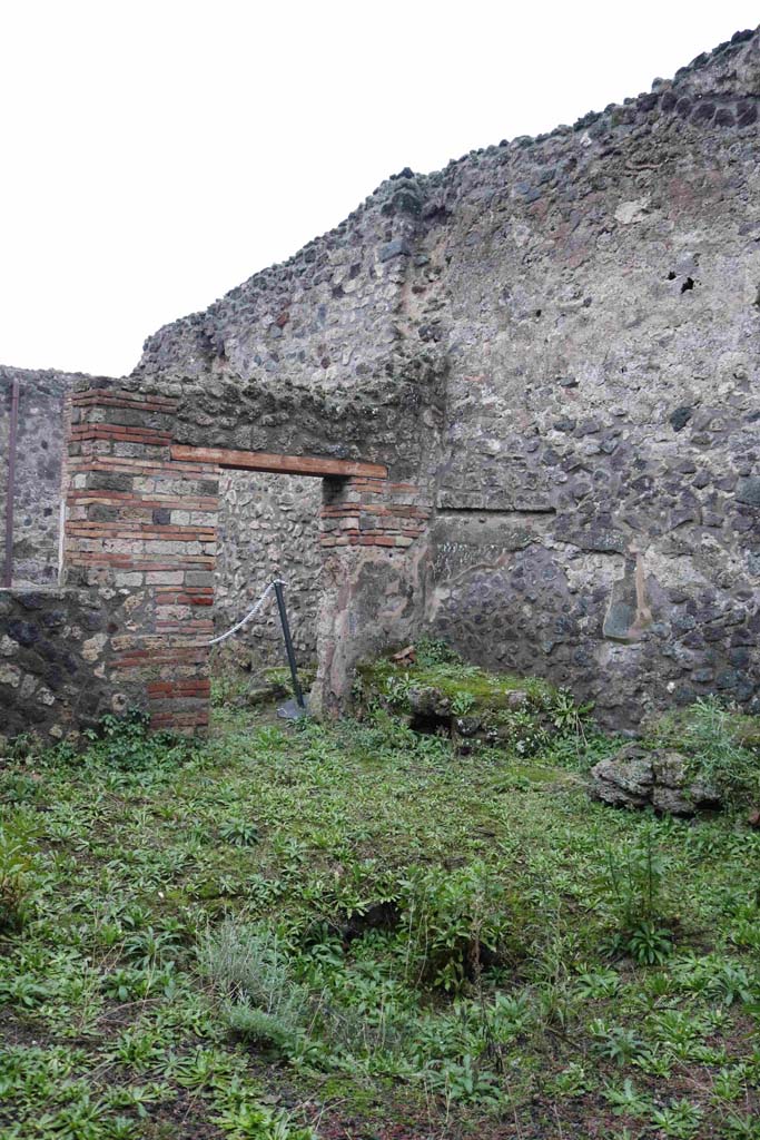IX.3.13 Pompeii. December 2018. 
Looking towards south-west corner of atrium with hearth and bench against west wall.
Photo courtesy of Aude Durand.