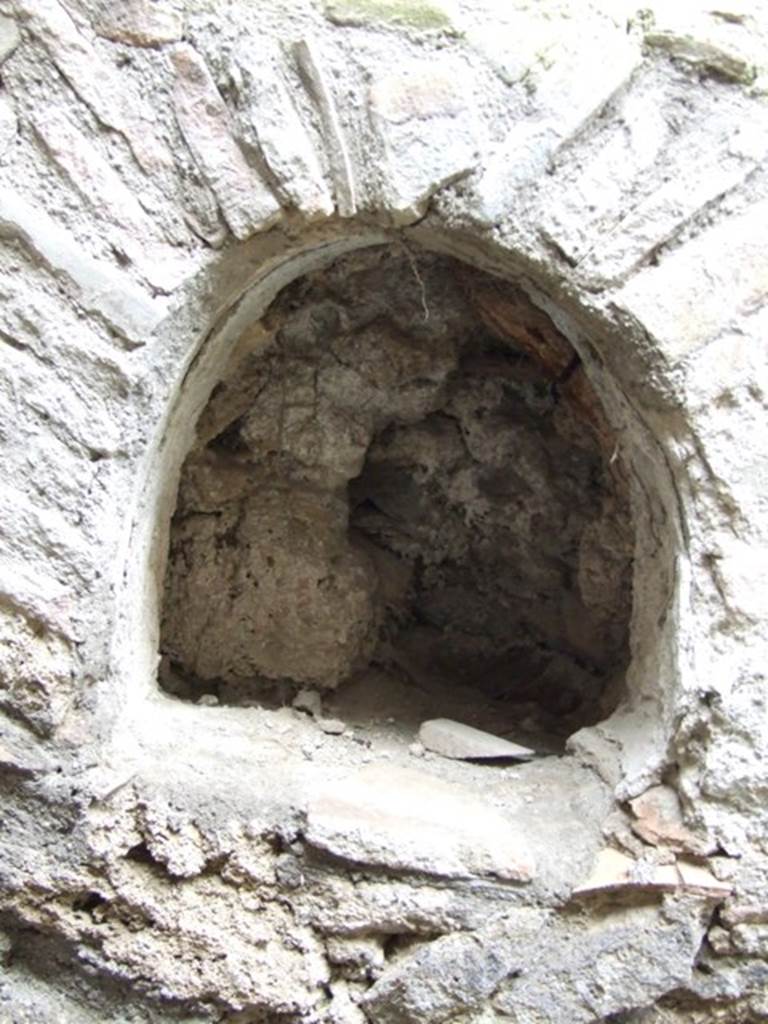 IX.3.13 Pompeii. March 2009. Niche. Boyce calls this an arched niche.
See Boyce G. K., 1937. Corpus of the Lararia of Pompeii. Rome: MAAR 14. (p.84, 412B)