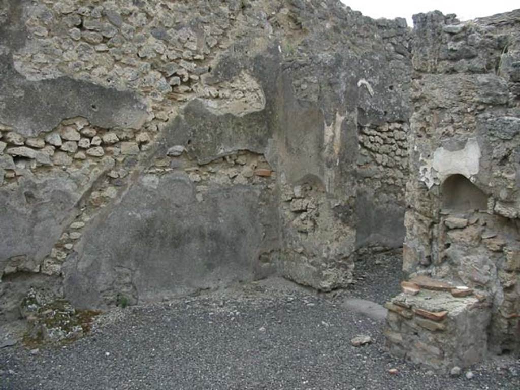 IX.3.14 Pompeii. May 2003. Outline of staircase in the plaster on west wall, and niche and altar on north wall.   Photo courtesy of Nicolas Monteix.