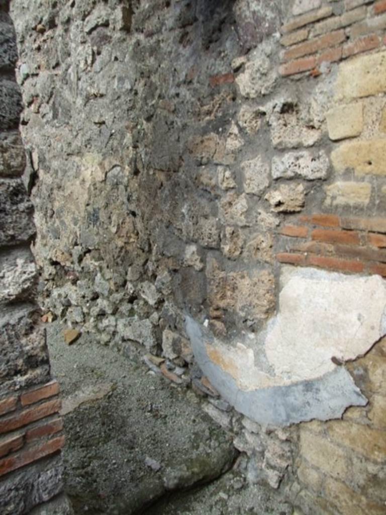 IX.3.15 Pompeii. March 2009. Room 5, small doorway with steps to room 6, in north-east corner.