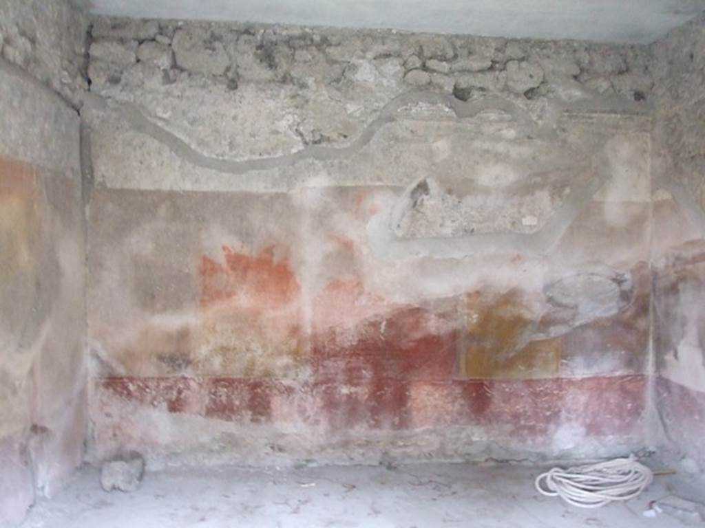 IX.3.19 Pompeii. December 2007. Room 12, west wall of room on west side of room 10.
The zoccolo (or lower plinth) was purple/violet, the middle zone of the wall had a red central aedicula. The upper zone of the wall was white and finished with a cornice of moulded stucco.