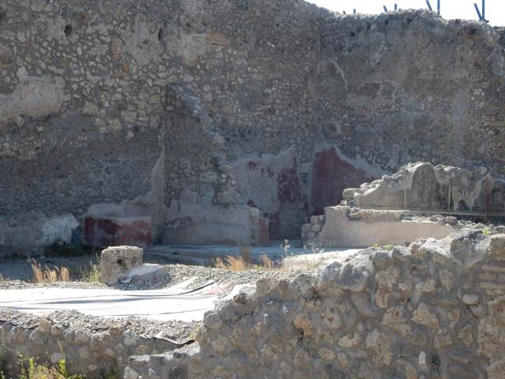IX.3.22 Pompeii. May 2017. Looking north-west from IX.3.21 towards rear room with painted wall decorations.  Photo courtesy of Buzz Ferebee.
