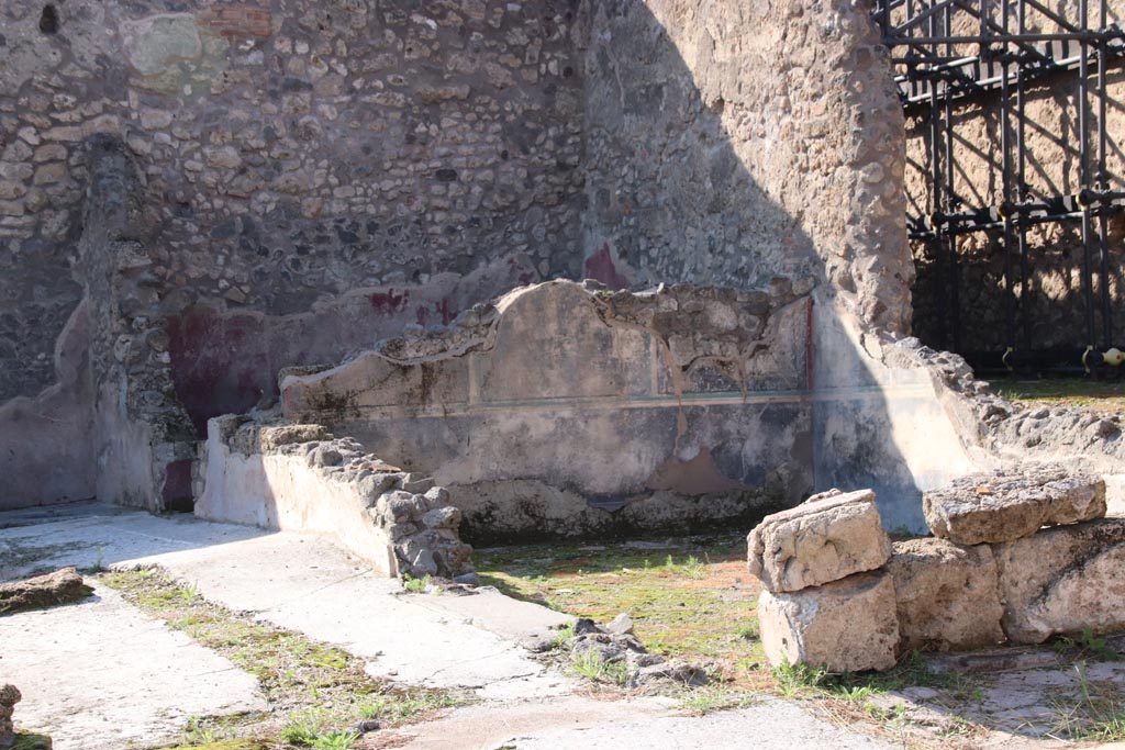 IX.3.22 Pompeii. October 2022. 
Looking towards room with black painted wall decorations towards north-west corner. Photo courtesy of Klaus Heese.