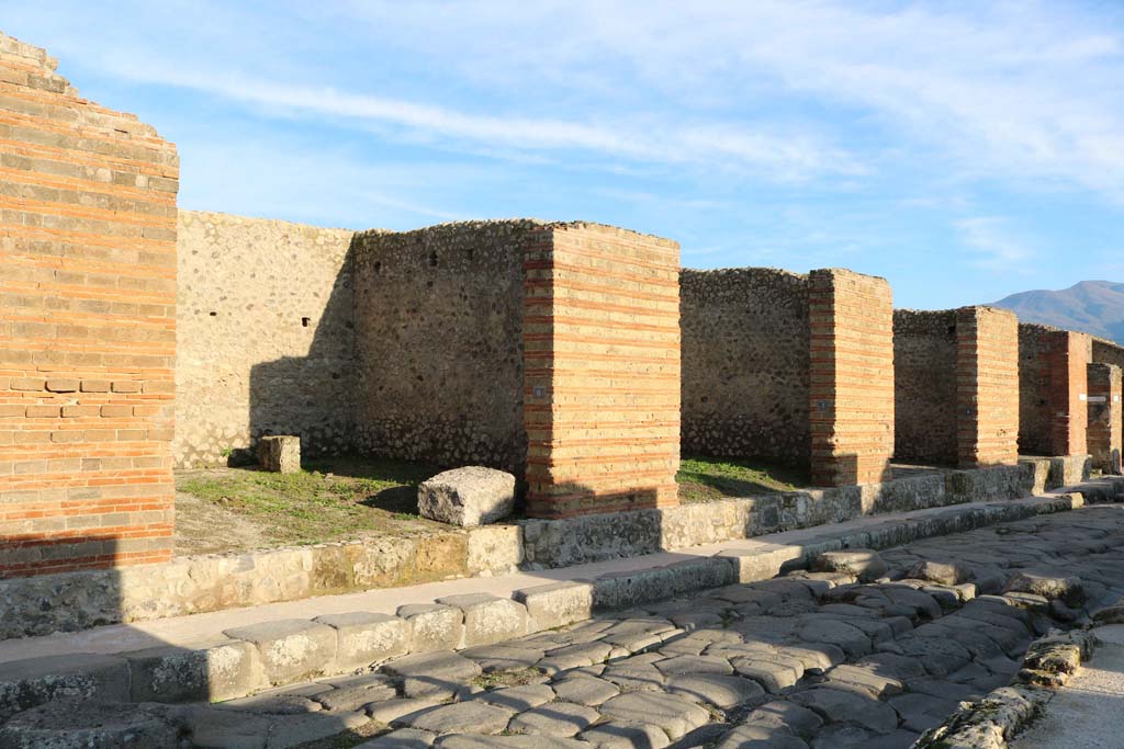 IX.4.6 Pompeii, on left. December 2018. 
Looking south along east side of roadway, IX.4.7, 8 and 9, are on the right. Photo courtesy of Aude Durand.