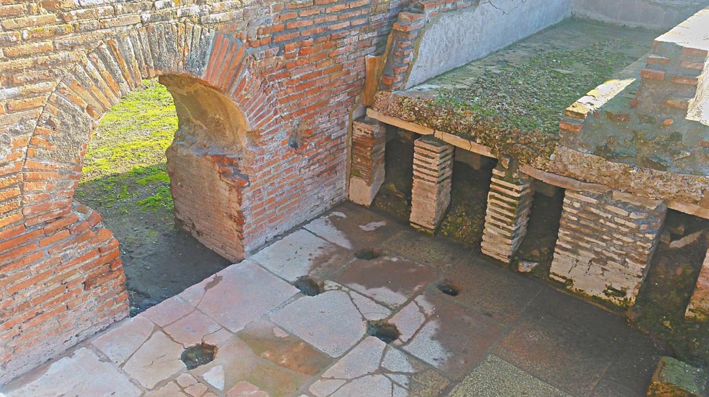 IX.4.18 Pompeii. December 2019. 
Caldarium “s”, looking south-east towards hypocaust flooring beneath bath at east end. Photo courtesy of Giuseppe Ciaramella.