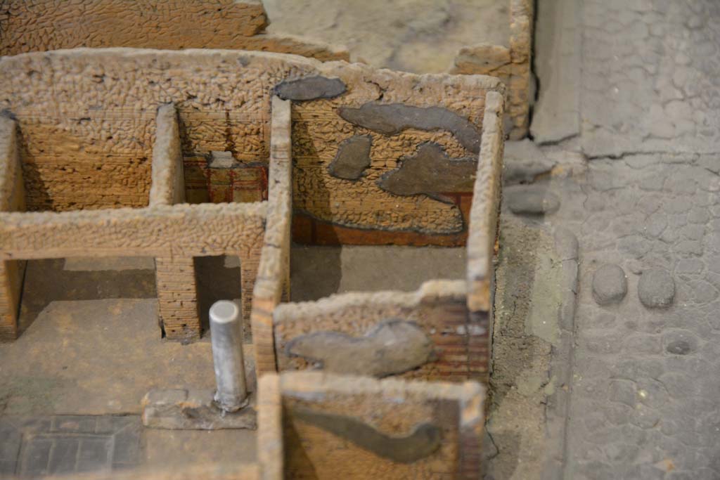IX.5.1 Pompeii. July 2017. Looking towards west wall of shop, and west wall of entrance corridor of IX.5.2, lower centre.
From cork model in Naples Archaeological Museum.
Foto Annette Haug, ERC Grant 681269 DÉCOR