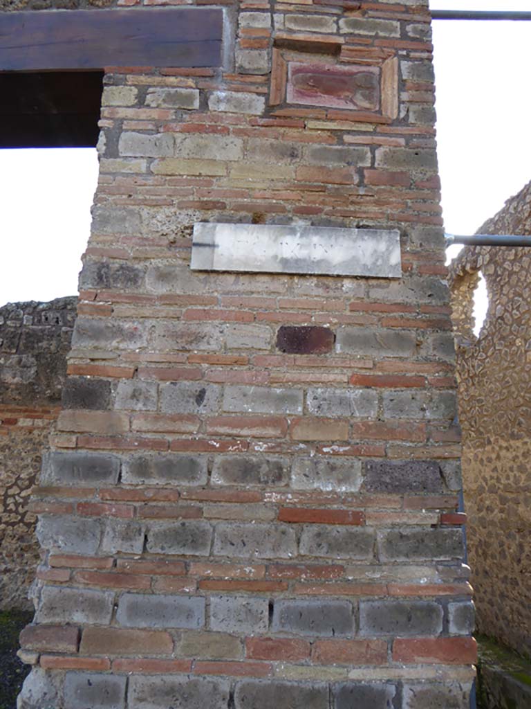 IX.5.1 Pompeii. January 2017. Terracotta wall plaque of phallus, on pilaster on west side of entrance
Foto Annette Haug, ERC Grant 681269 DÉCOR.
