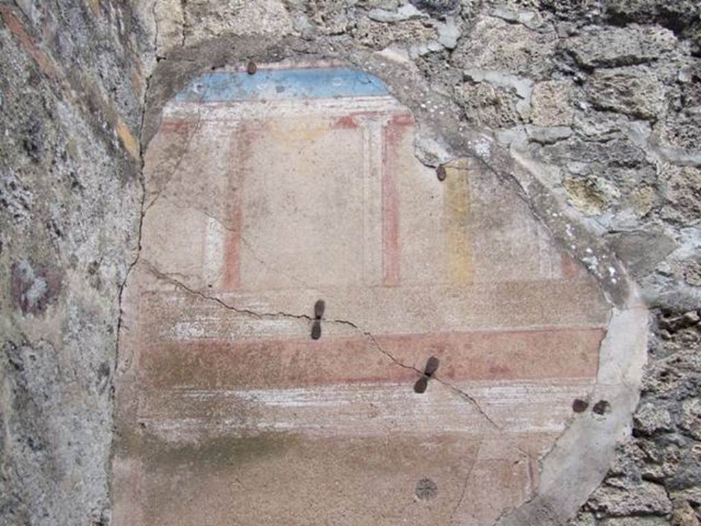 IX.5.2 Pompeii. December 2007. Room 11, remains of painted plaster at west end of north wall.