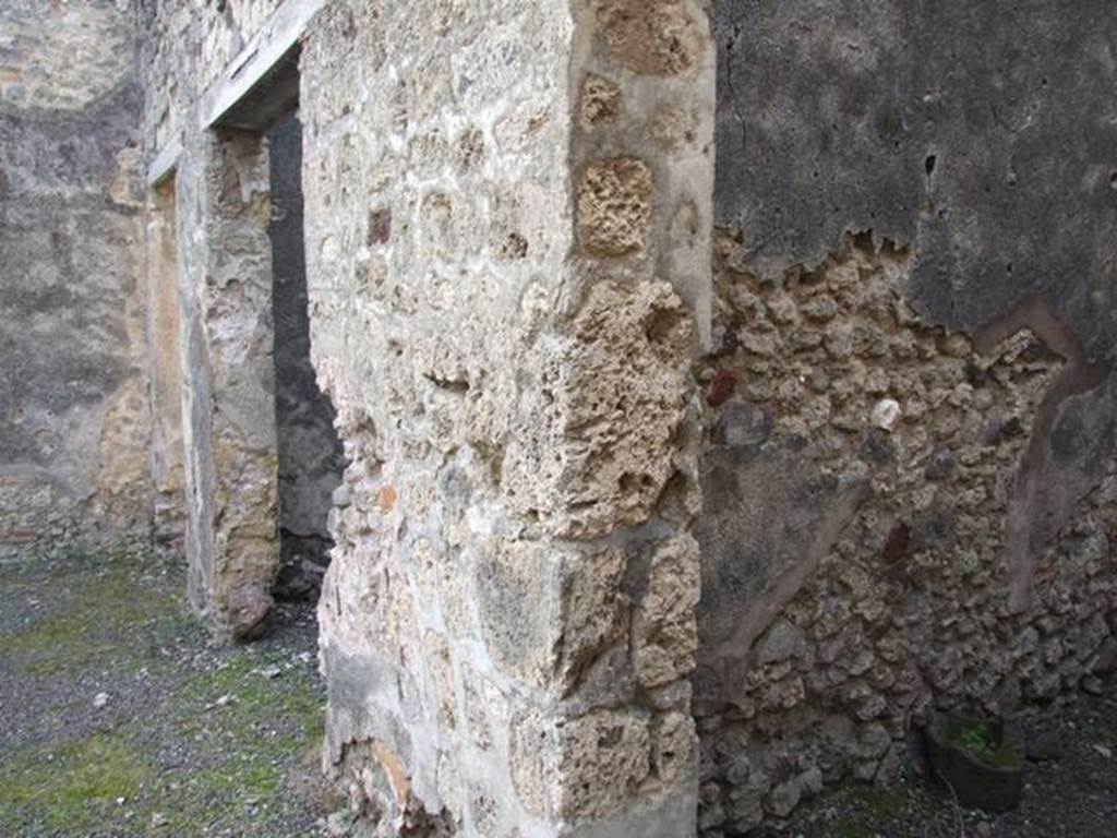 IX.5.2 Pompeii. December 2007. 
Looking south to doorways to rooms ‘q’ and ‘r’ on west side of peristyle, and corridor leading to IX.5.22 the rear entrance. 
According to Boyce, in the west wall of a room on the upper floor, above the first room on the west side of the peristyle, was a rectangular niche.
See Boyce G. K., 1937. Corpus of the Lararia of Pompeii. Rome: MAAR 14. (p. 85, no. 420)