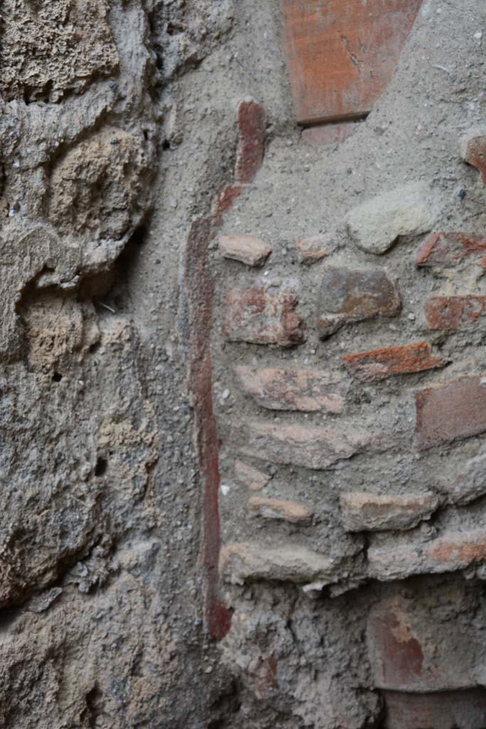 IX.5.4 Pompeii. March 2017. 
Room f, detail of remaining painted plaster on west wall at base of terracotta downpipe.
Foto Christian Beck, ERC Grant 681269 DÉCOR.