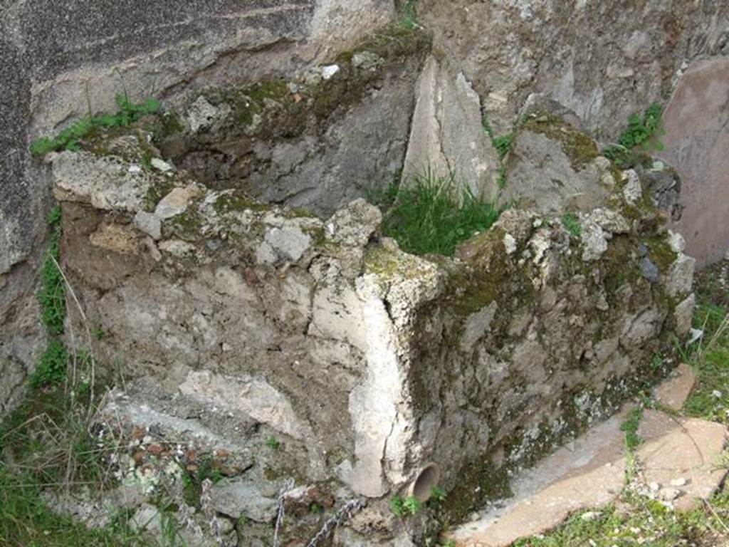 IX.5.6 Pompeii. December 2007.  Room u, masonry basin with water pipe, to south of room 13 on west wall of garden area. According to both Richardson and Jashemski, near this basin four marble heads were found, including an Epicurus and two other philosophers. See Richardson, L., 1988. Pompeii: an Architectural History. Baltimore: John Hopkins University Press.  Jashemski said that three were heads of men, one of a woman. All were of the same marble and excellent workmanship. Mau thought they were to be attached to a wall, Dwyer suggested that they may have been cut to place back-to-back as double herms. Although, under examination he found that no two heads fitted together. The marble heads are now in the Naples Archaeological Museum, inventory numbers 111389, 111390, 111391 and 111392. 
See Jashemski, W. F., 1993. The Gardens of Pompeii, Volume II: Appendices. New York: Caratzas. (p.236) According to Pompeii, the richest series of little busts of philosophers was found here, Demosthenes, one alleged to portray Seneca, Epicurus and a woman, perhaps Leontion, the philosopher’s student and companion. See Panetta, M.R. (ed): Pompeii, the history, life and art of the buried city. Italy, White Star Publishers: (p.269)