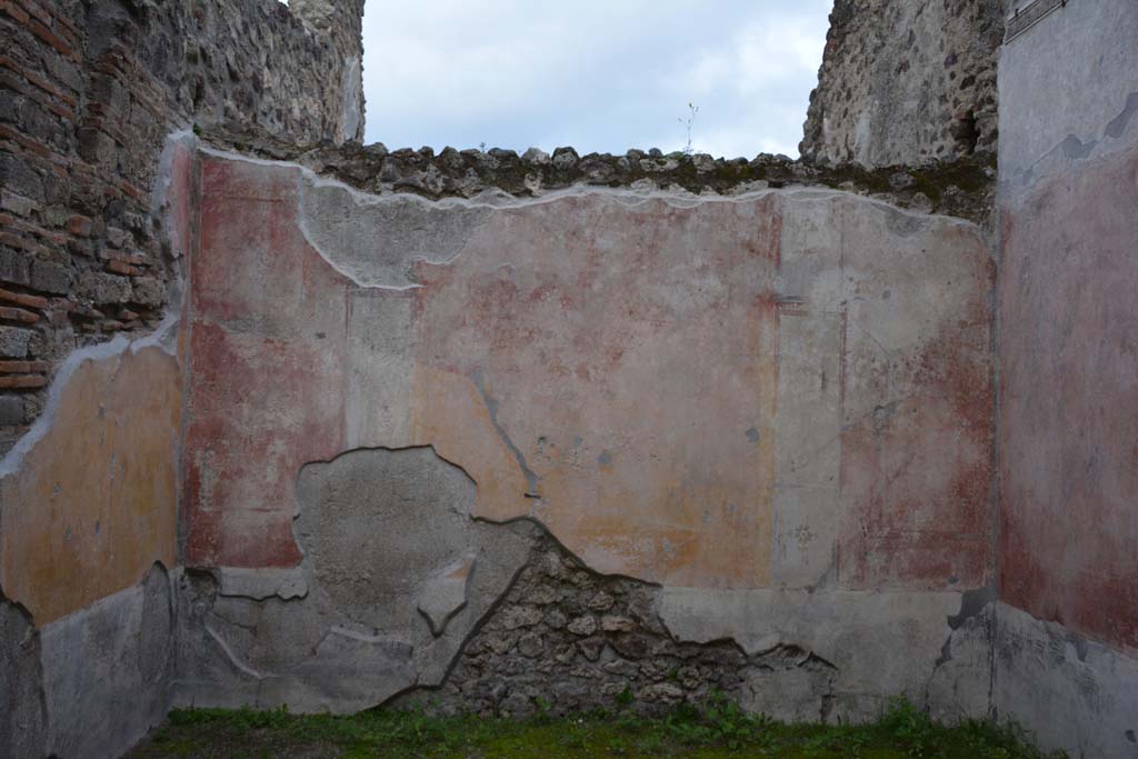 IX.5.9 Pompeii. March 2017. Room “p”, looking towards east wall.
Foto Christian Beck, ERC Grant 681269 DÉCOR.
According to PPM –
The east wall was decorated in IV style with panels with painted plants in a high black zoccolo, and in the middle zone, the central panel was yellow and the side panels were red, separated by architecture; the carpet borders on the side panels continued onto the nearby panels on the next wall in the manner to give the impression that large panels enclosed the entire room as a unit. 
See Carratelli, G. P., 1990-2003. Pompei: Pitture e Mosaici. IX (9). Roma: Istituto della enciclopedia italiana, (p.525).