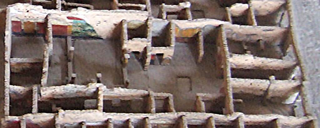 IX.5.9 Pompeii. House as recorded on the model in Naples Archaeological Museum.  
Note the colourful painting that was on the west wall of the peristyle.
According to Jashemski, there was a large animal painting, only partially preserved upon excavation, on the west wall.
See Jashemski, W. F., 1993. The Gardens of Pompeii, Volume II: Appendices. New York: Caratzas. (p.237 & No.94 on p.366)