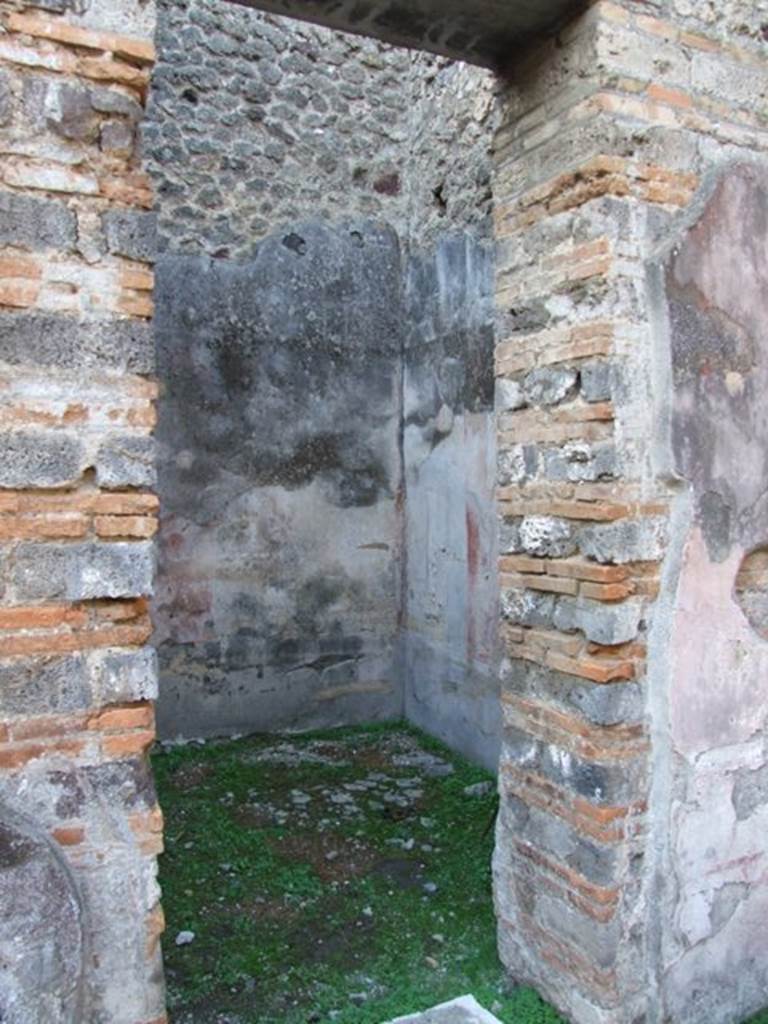 IX.5.11 Pompeii. December 2007. Doorway to room d, looking north-west.
This room would have been decorated in the IVth Style.