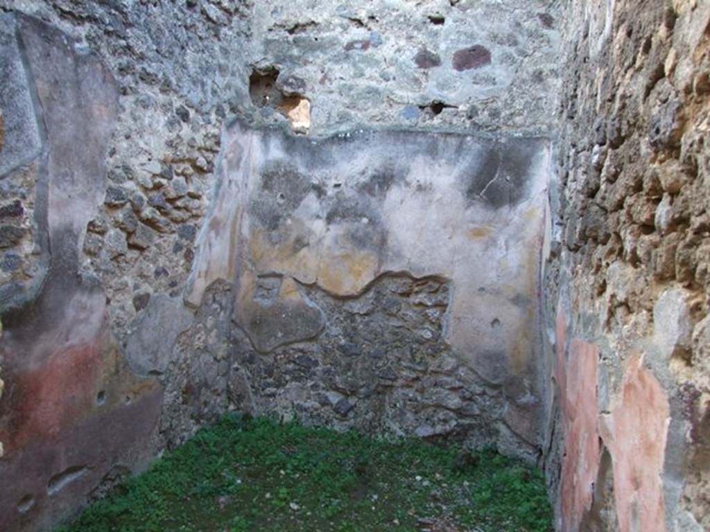 IX.5.11 Pompeii. December 2007. Room 18, cubiculum, looking west. The decoration of the walls in this cubiculum was in the IVth Style, with red zoccolo. The middle zone of the walls had traces of burning.