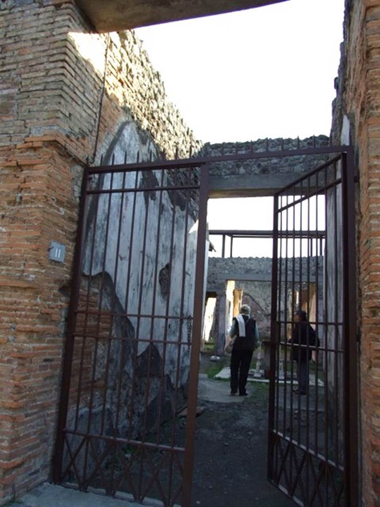 IX.5.11 Pompeii. December 2007. East wall of entrance corridor. According to NdS, like many others, this houses was ransacked, since its walls are almost all riddled with holes. 
See Notizie degli Scavi, 1877, (p.247)