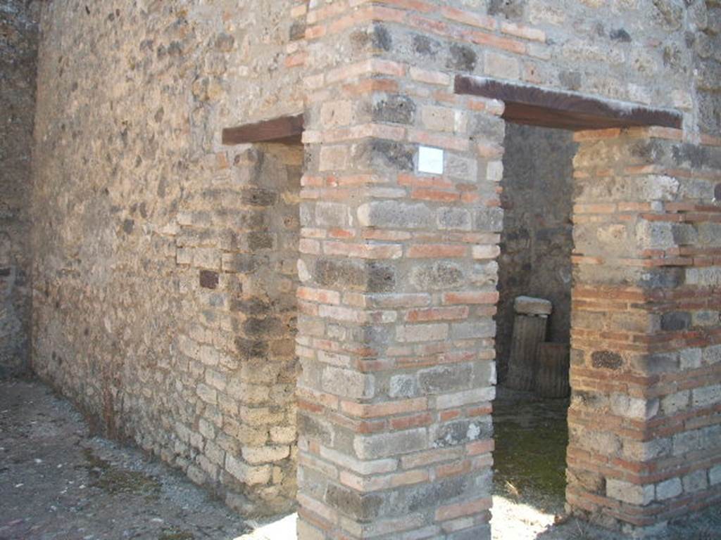 IX.5.14 Pompeii. May 2005. Looking south-east towards third exedra or triclinium, room “o”, with two doorways.
One doorway in the south wall of the second exedra “n”, one doorway from the east portico.
See Eschebach, L., 1993. Gebäudeverzeichnis und Stadtplan der antiken Stadt Pompeji. Köln: Böhlau. (p.425) 
According to Richardson and Schefold, three paintings were found in triclinium “o”.
Schefold describes triclinium “o” as triclinium l. v. der N-Ala, which equates to room “f’”.
According to PPP and PPM they were found in room “f”. See our room “f” for these paintings.
All now in Naples Archaeological Museum.
Pyramus and Thisbe. Naples Inventory number 111483. 
Pair of men before an enthroned queen (Aeneas before Dido?). Naples Inventory number 111480. 
Bacchus and Ariadne with thiasus. Naples Inventory number 111481.
See Bragantini, de Vos, Badoni, 1986. Pitture e Pavimenti di Pompei, Parte 3. Rome: ICCD, p. 482-3. 
See Carratelli, G. P., 1990-2003. Pompei: Pitture e Mosaici.  Roma: Istituto della enciclopedia italiana, Vol IX, pp. 623-634. 
See Richardson, L., 2000. A Catalog of Identifiable Figure Painters of Ancient Pompeii, Herculaneum. Baltimore: John Hopkins, p. 153.
See Schefold, K., 1957. Die Wände Pompejis. Berlin: De Gruyter, p. 260.