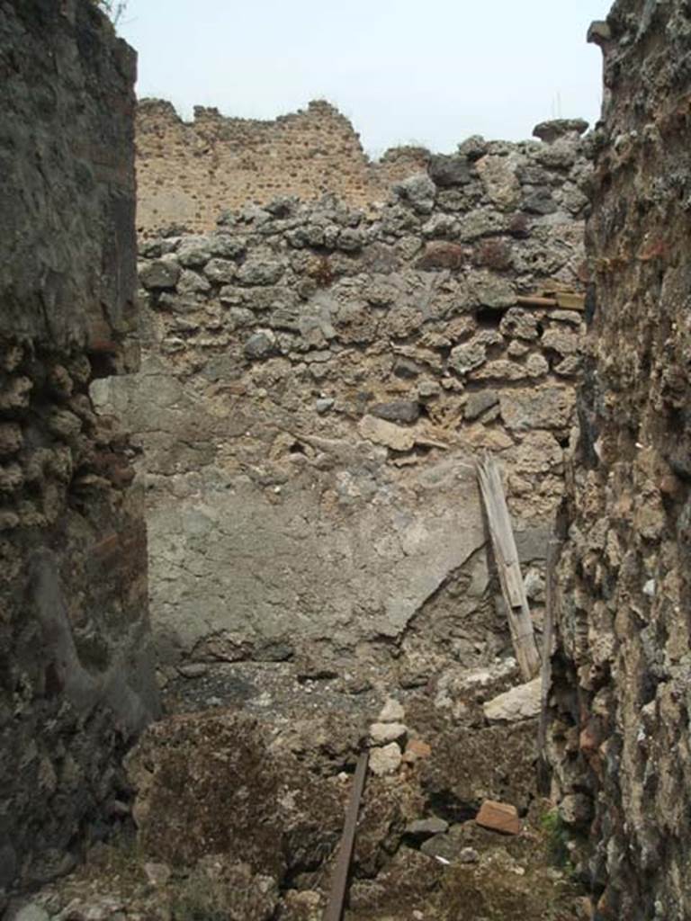 IX.5.14 Pompeii. May 2005. 
Looking north across area of room “u”, stairs to upper floor, between rooms “r” and “q”.