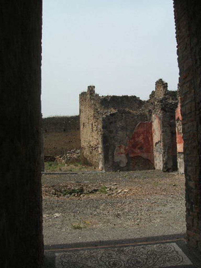 IX.5.14 Pompeii. May 2005. Looking north-west across atrium "b". The doorway to the peristyle can be seen on the left. The doorway to a triclinium can be seen on the right (not photographed) According to PPP, this room is “room f”, and found in it were the under-mentioned paintings. According to Richardson, found in triclinium “o” were the following paintings.  All now in Naples Archaeological Museum.
Pyramus and Thisbe,   (Naples Inventory number 111483), 
Pair of men before an enthroned queen (Aeneas before Dido?)   (Naples Inventory number 111480),  Bacchus and  Ariadne with thiasus   (Naples Inventory number 111481). See Richardson, L., 2000. A Catalog of Identifiable Figure Painters of Ancient Pompeii, Herculaneum. Baltimore: John Hopkins. (p.153)  See Bragantini, de Vos, Badoni, 1986. Pitture e Pavimenti di Pompei, Parte 3. Rome: ICCD.
