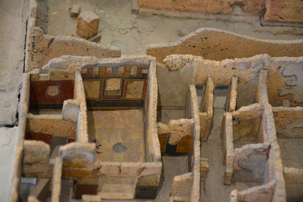 IX.5.18/19 Pompeii. July 2017. 
Looking west to rooms e and f in south-west corner, with doorways at IX.5.20/21, centre right, onto Vicolo di Tesmo. 
From cork model in Naples Archaeological Museum.
Foto Annette Haug, ERC Grant 681269 DÉCOR