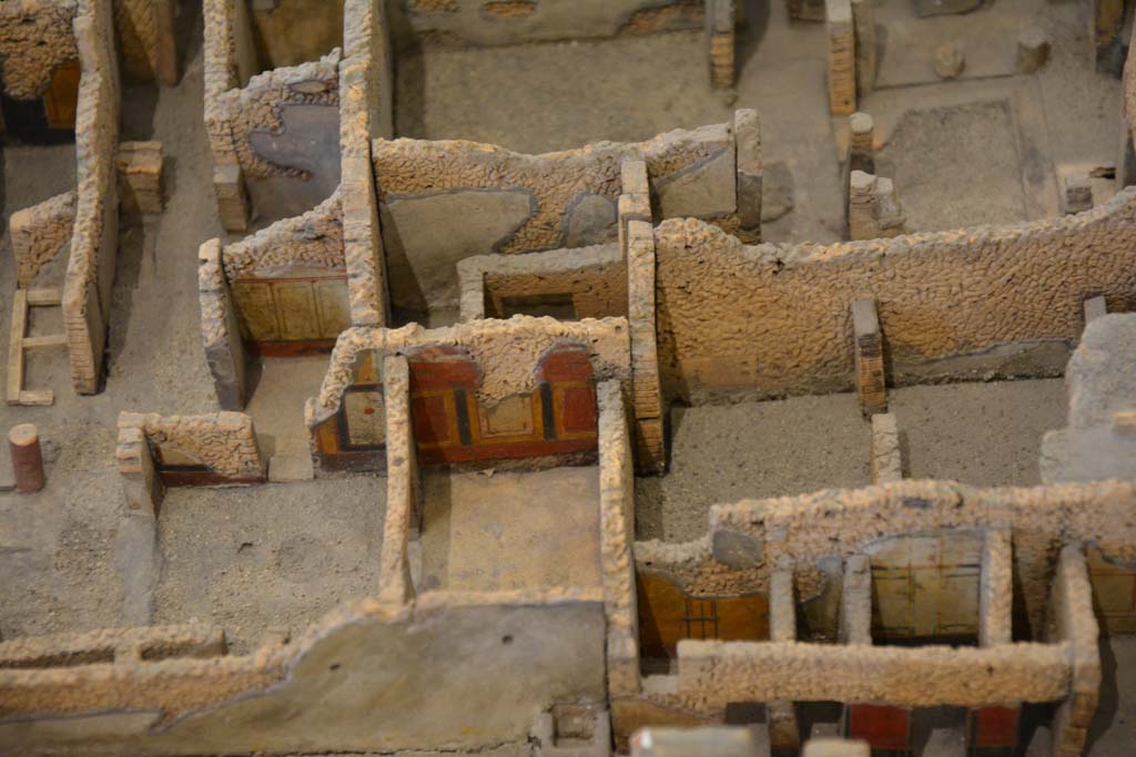 IX.5.18 Pompeii. July 2017. 
On the left and lower centre are rooms in north-east corner, corridor “q”, rooms s, r, p with doorway into l (L), with room o, in centre. 
On the right are rooms in IX.5.2, 4 and 6.
From cork model in Naples Archaeological Museum.
Foto Annette Haug, ERC Grant 681269 DÉCOR