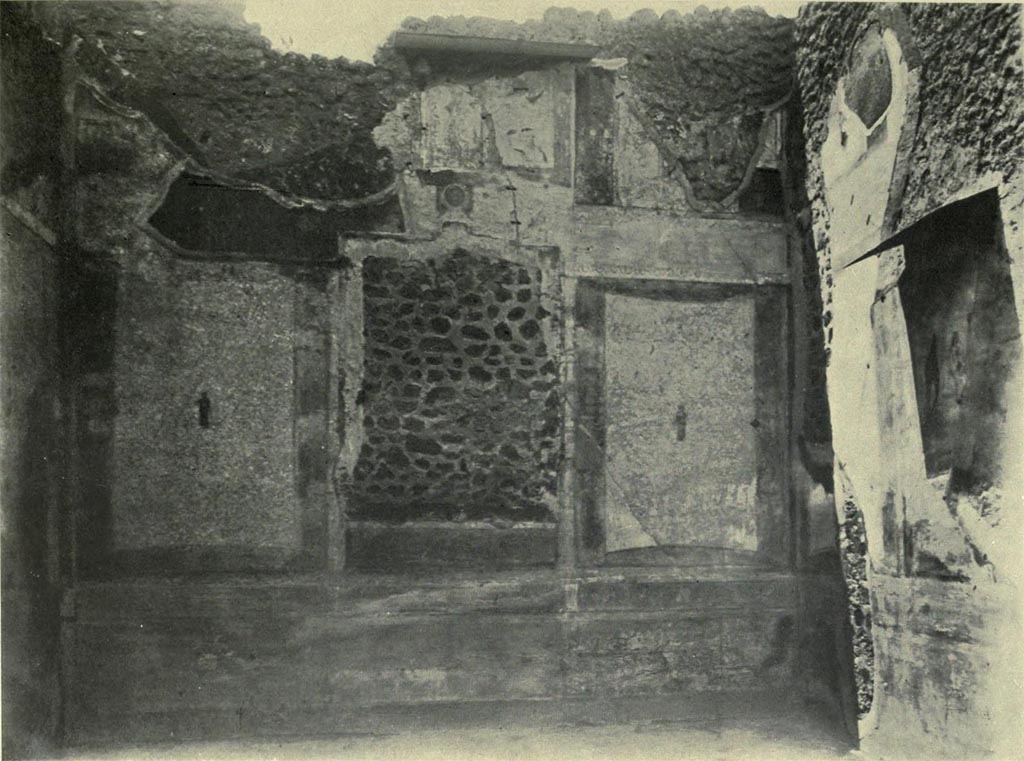 IX.5.18 Pompeii. Room f, west wall of large triclinium on west side of atrium, with north wall, on right.
See Van Buren, A. W. 1932. Further Pompeian Studies in Memoirs of American Academy in Rome, vol.10, (pl.10), and p.38-40.
Article by A. W. Van Buran, entitled “…..and he is bearing the babe Dionysus”.
