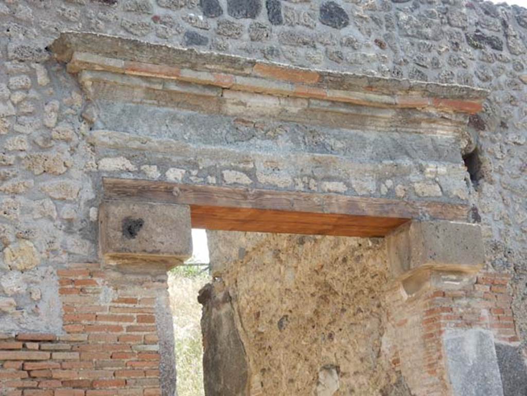 IX.7.16 Pompeii, May 2018. Detail of top of doorway after renovation. Photo courtesy of Buzz Ferebee.