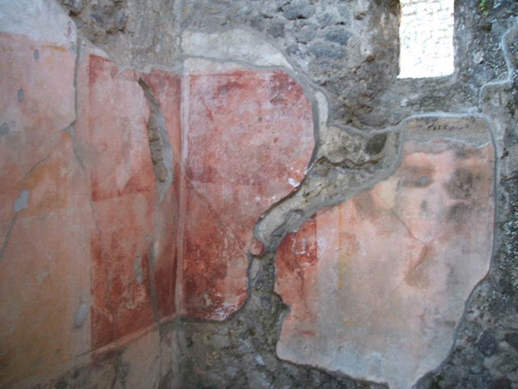 IX.7.20 Pompeii. May 2005. Room (c ), south-west corner of cubiculum, with window onto Vicolo di Tesmo in west wall.
According to PPP, the west wall of this cubiculum (room c) was painted with a central panel of yellow.
The side panels were red with painted medallions. The lower area was uncoloured.
See Bragantini, de Vos, Badoni, 1986. Pitture e Pavimenti di Pompei, Parte 3. Rome: ICCD. (p.503)
