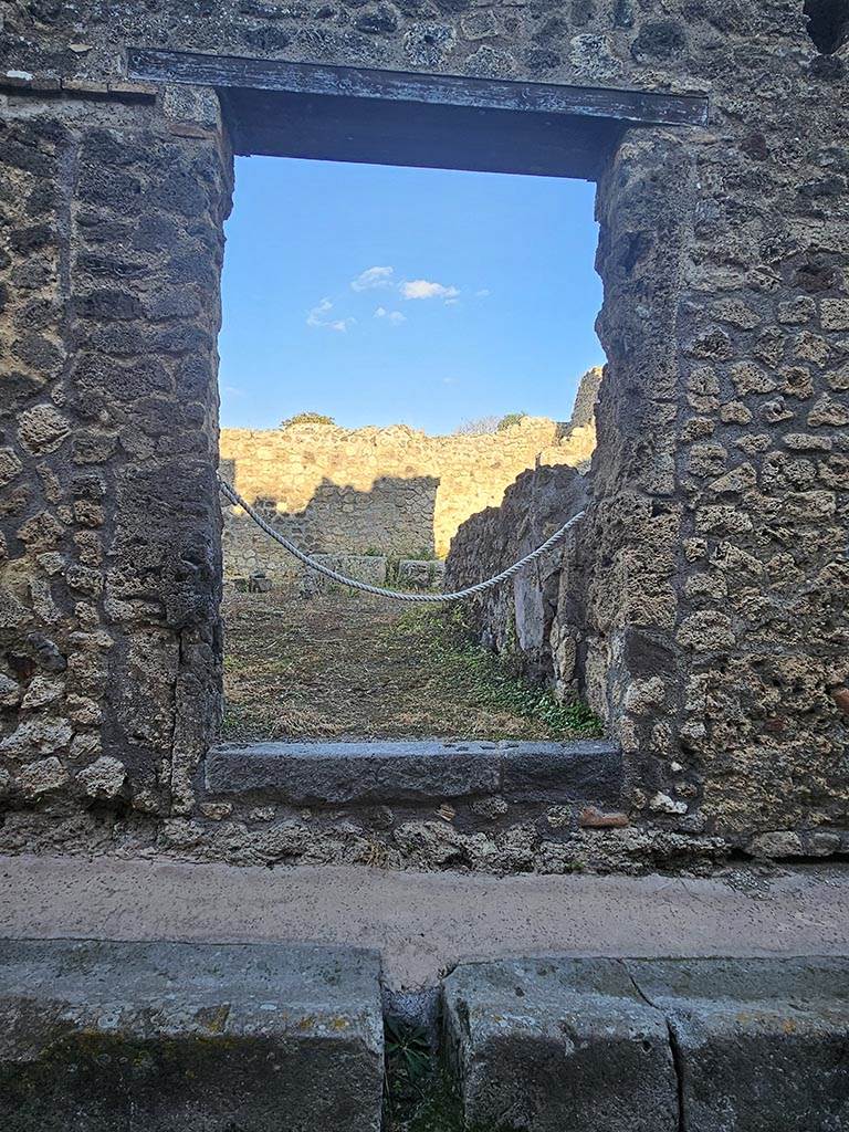 IX.7.21 Pompeii. November 2024. 
Looking east through entrance doorway. Photo courtesy of Annette Haug.