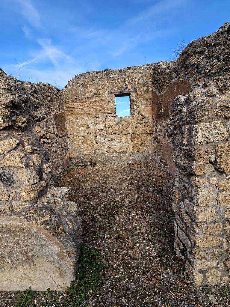 IX.7.21/22 Pompeii. November 2024. 
Looking north through doorway in north-east corner of atrium. Photo courtesy of Annette Haug.