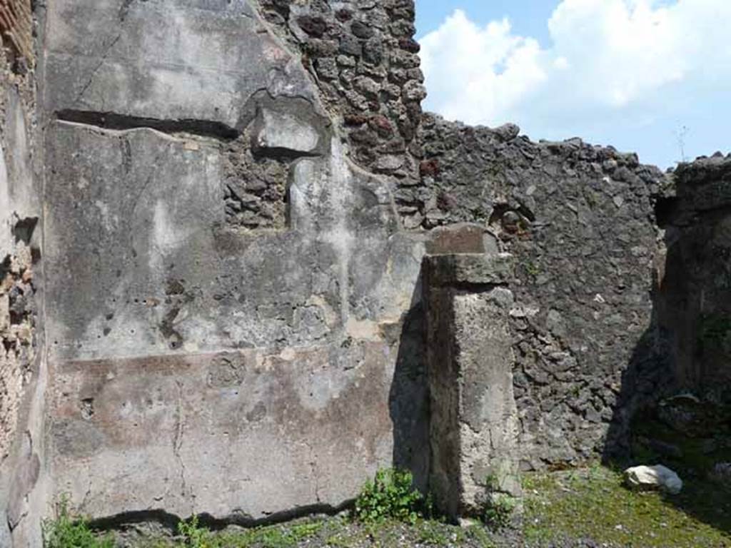 IX.8.2 Pompeii. May 2010. East wall of front and rear rooms.
According to Garcia y Garcia, a painting of a sacred landscape would have been seen in the centre of the east wall. This was soon lost and is no longer visible.  Two drawings of the painting can be found in the German Archaeological Institute of Rome.  See Garcia y Garcia, L., 2005. Pupils, Teachers and Schools in Pompeii. Roma: Bardi editore. (p. 72-3, with figs 41-42 showing two drawings of the sacred landscape).
See De Carolis, E. 1989. Italienische Reise. Naples: Bibliopolis, (p. 250 & fig. 93 on page 323) There was a frieze on a black background on the upper walls.  A small trace survived on the east wall, depicting figures of philosophers. Five drawings of these can be seen in Fig.120, of Schefold, but it says they were found at the shop at IX.8.4.
See Schefold, K., 1962. Vergessenes Pompeji. Bern: Francke. (Fig.120)