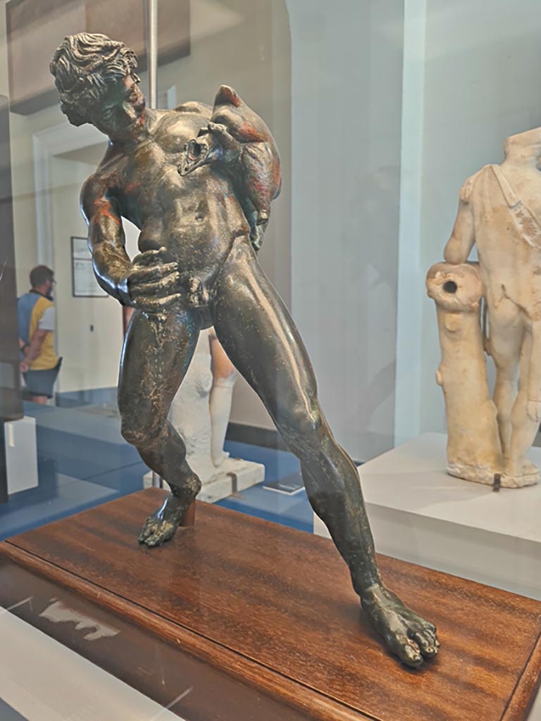IX.8.6 Pompeii. October 2023. 
Bronze fountain figure of a Satyr pouring wine, inv. 111495. Photo courtesy of Giuseppe Ciaramella. 
On display in “L’altra MANN” exhibition, October 2023, at Naples Archaeological Museum.