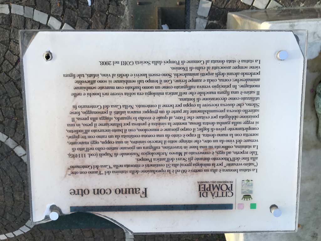 IX.8.6 Pompeii. April 2019. Notice-board accompanying reproduction statue of Satyr with wineskin, now to be found on a road on the south side of Pompeii Scavi. Photo courtesy of Rick Bauer.